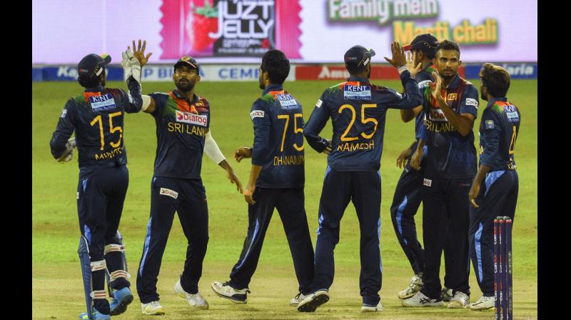 Sri Lanka players celebrate after the dismissal Indias Ruturaj Gaikwad during their second T20 match at the R.Premadasa Stadium in Colombo on Wednesday. -- AFP