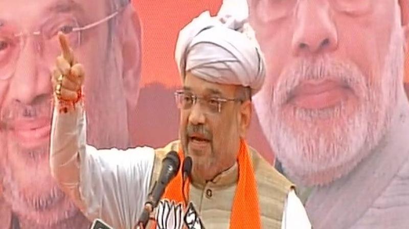 Speaking at 'Gujarat Gaurav Yatra' in Porbandar BJP Chief Amit Shah said, 'Rahul always questions what Prime Minister Narendra Modi did in past three years, but I want to ask what UPA did in 10 years.' (Photo: ANI | Twitter) Speaking at 'Gujarat Gaurav Yatra' in Porbandar BJP Chief Amit Shah said, 'Rahul always questions what Prime Minister Narendra Modi did in past three years, but I want to ask what UPA did in 10 years.' (Photo: ANI | Twitter)