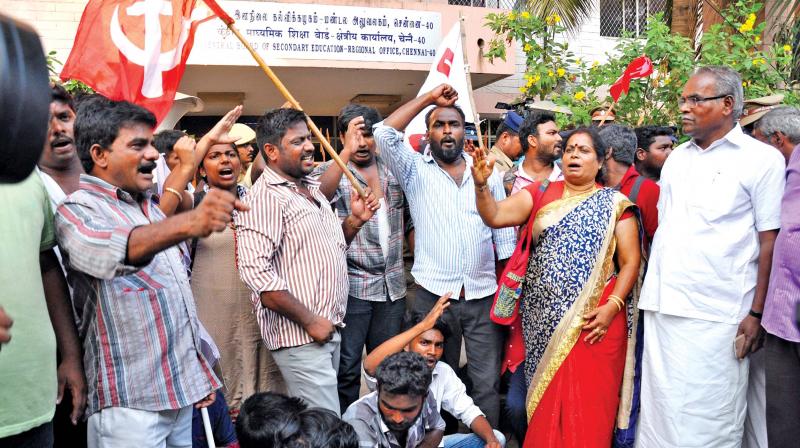 CPI (M) state secretary K.Balakrishnan and party members protest before CBSE regional office in Anna Nagar, condemning the allocation of exam centres to NEET applicants in other states, on Friday. (Photo:DC) CPI (M) state secretary K.Balakrishnan and party members protest before CBSE regional office in Anna Nagar, condemning the allocation of exam centres to NEET applicants in other states, on Friday. (Photo:DC)