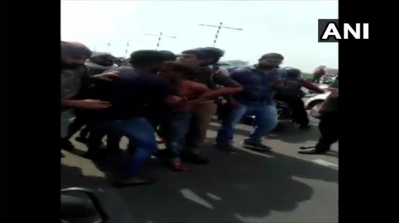 The driver, who was allegedly in an inebriated state, was brutally thrashed by the public present in the area. (Photo: Twitter/ ANI) The driver, who was allegedly in an inebriated state, was brutally thrashed by the public present in the area. (Photo: Twitter/ ANI)