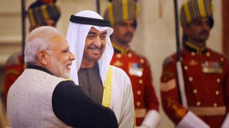 Prime Minister Narendra Modi and Crown Prince of Abu Dhabi General Sheikh Mohammed Bin Zayed Al Nahyan during an At-Home reception on the occasion of 68th Republic Day at Rashtrapati Bhavan in New Delhi on Thursday. (Photo: PTI) Prime Minister Narendra Modi and Crown Prince of Abu Dhabi General Sheikh Mohammed Bin Zayed Al Nahyan during an At-Home reception on the occasion of 68th Republic Day at Rashtrapati Bhavan in New Delhi on Thursday. (Photo: PTI)