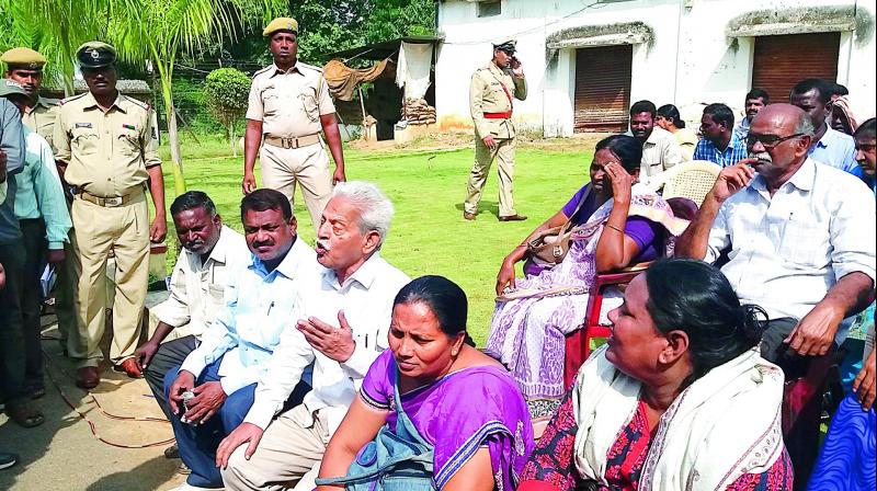 Varavara Rao (sitting 3rd from the left in the front row) with family members of slain Maoists in Malkangiri on Wednesday. Varavara Rao (sitting 3rd from the left in the front row) with family members of slain Maoists in Malkangiri on Wednesday.