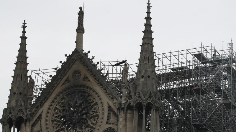 The fire, which at one point threatened the entire edifice, was extinguished Tuesday around 15 hours after it first broke out. (Photo:AP) The fire, which at one point threatened the entire edifice, was extinguished Tuesday around 15 hours after it first broke out. (Photo:AP)