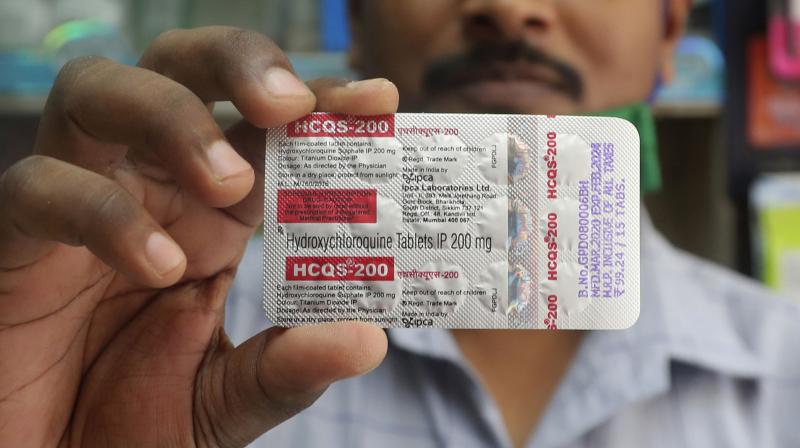 A chemist holds a pack of hydroxychloroquine tablets in Mumbai, India. (AP)