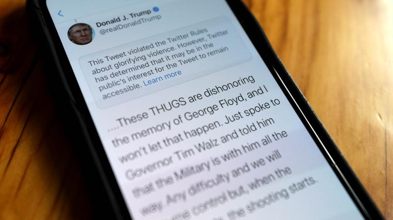 a notification from Twitter appears on tweet by U.S. President Donald Trump that the social media platform says violated its policy. (AFP) a notification from Twitter appears on tweet by U.S. President Donald Trump that the social media platform says violated its policy. (AFP)