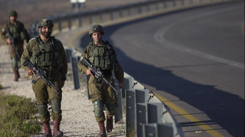 Israeli soldiers patrol roads. (AP) Israeli soldiers patrol roads. (AP)