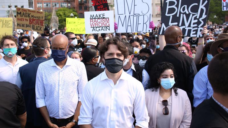 Canadadian Prime Minister Justin Trudeau (C) takes part in a Black Lives Matter protest on Parliament Hill.(AFP) Canadadian Prime Minister Justin Trudeau (C) takes part in a Black Lives Matter protest on Parliament Hill.(AFP)