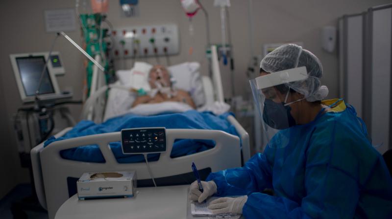 A nurse works at the Intensive Care Unit (ICU) ward where patients infected with the novel coronavirus, COVID-19, are being treated at the Doctor Ernesto Che Guevara Public Hospital in Marica city, state of Rio de Janeiro, Brazi. (AFP)