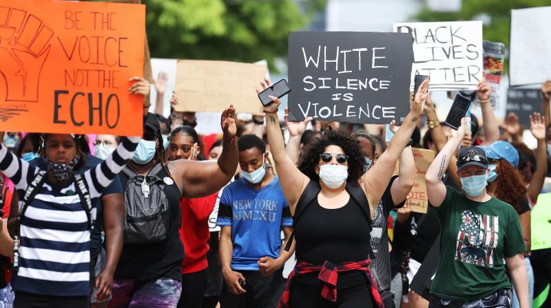 Protesters march on June 07, 2020 in Freeport, New York. (AFP)