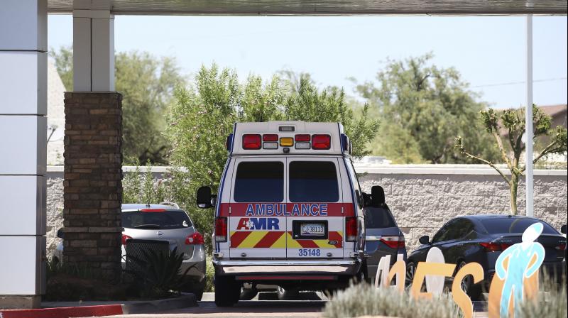 An ambulance is parked at Arizona General Hospital shown in Laveen, Ariz., as Arizona hospitals that are expected to be able to treat new cases of coronavirus without going into crisis mode were above 80% capacity Tuesday, a milestone that should trigger an automatic stop to elective surgeries at affected hospitals. (AP)