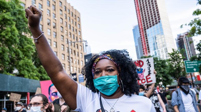 People participate in a march in Brooklyn for both Black Lives Matter and to commemorate the 155th anniversary of Juneteenth on June 19, 2020 in New York City.  (AFP)