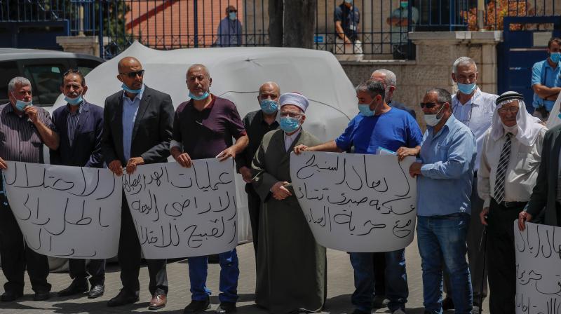 Palestinians demonstrate in front of the EU offices in east Jerusalem during a demonstration demanding from the EU to intervene in Israels plans to annex West Bank settlements and the Jordan Valley Jerusalem. (AFP)