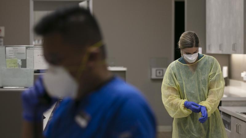 Physician assistant gets ready for COVID-19 testing at Xpress Urgent Care in Tustin, California. (AP)