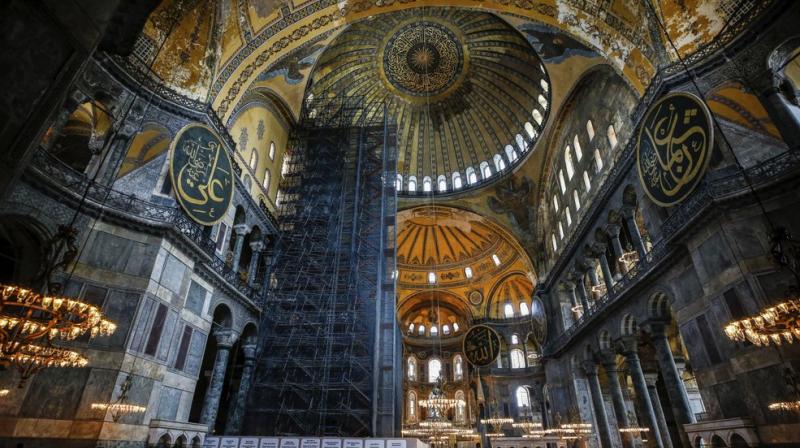 People visit the Byzantine-era Hagia Sophia, one of Istanbuls main tourist attractions in the historic Sultanahmet district of Istanbul. (AP)