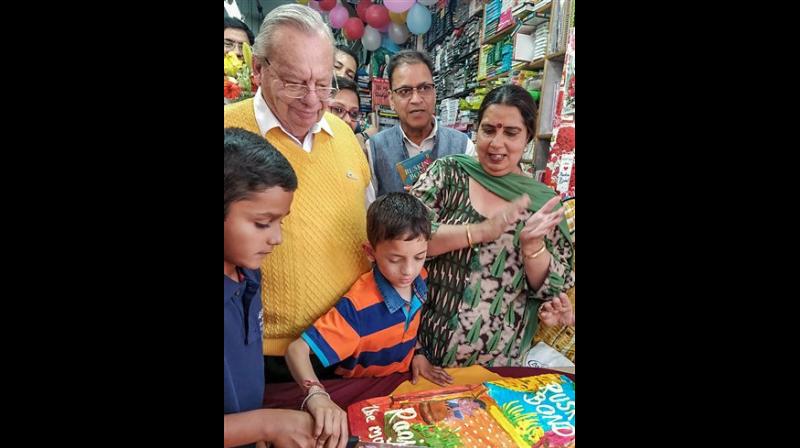 Author Ruskin Bond celebrates his birthday by cutting a cake with children who share their birthdays with him, at Cambridge Bookstore in Mussoorie, on Saturday. (Photo: PTI) Author Ruskin Bond celebrates his birthday by cutting a cake with children who share their birthdays with him, at Cambridge Bookstore in Mussoorie, on Saturday. (Photo: PTI)