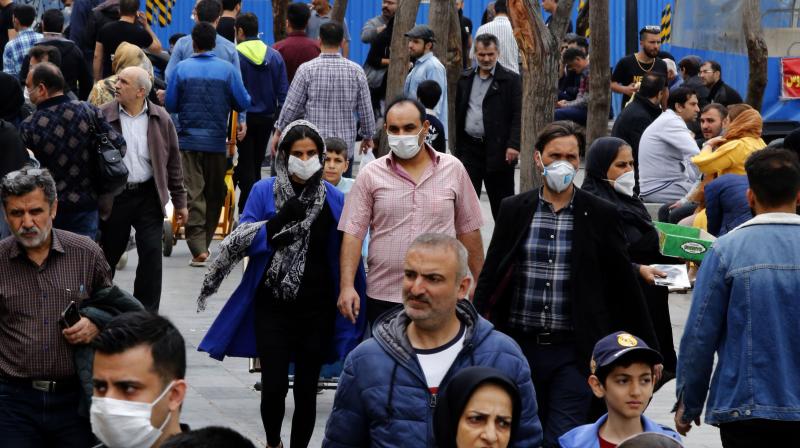 Iranians, some wearing protective masks, gather inside the capital Tehrans grand bazaar, during the Covid-19 coronavirus pandemic crises. AFP Photo