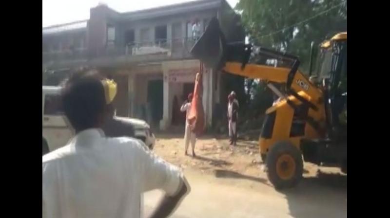 The land belongs to gram panchayat. A man, Vagha Ram, illegally encroached the land later the panchayat acted against it. After this, the debris was cleared. Now, he is again encroaching the land and now constructing a wall there. When we went there, he indulged in the scuffle. We have also given a report to police but they did not act, Rekha Devi said. (Photo: ANI)