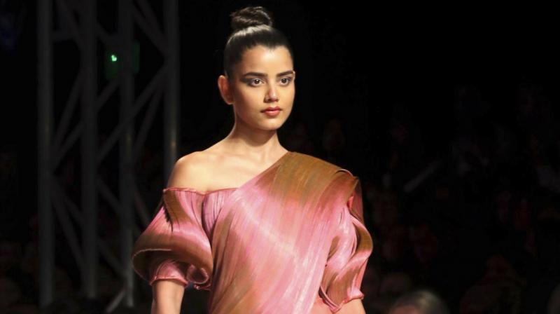 The Lotus Make-Up India Fashion Week finale was an ode to the sari, worn by the runway models in modern, reconstructed forms, along with elaborate jewellery and accessories. The Lotus Make-Up India Fashion Week finale was an ode to the sari, worn by the runway models in modern, reconstructed forms, along with elaborate jewellery and accessories.