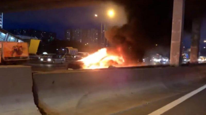 Footage of the incident on state TV channel Rossiya 24 showed the car on fire by the side of the road. Footage of the incident on state TV channel Rossiya 24 showed the car on fire by the side of the road.