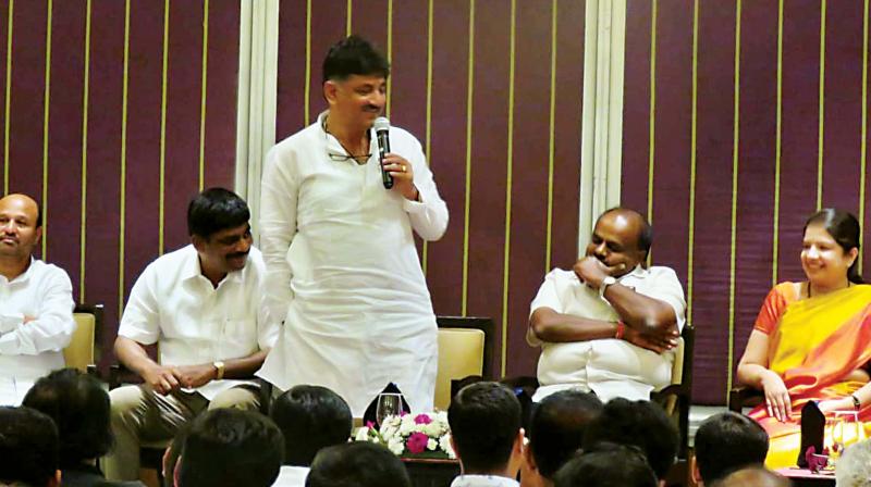 Water Resources Minister D.K. Shivakumar speaks at a meeting on Ramanagara bypoll in Bengaluru on Monday. Chief Minister H.D. Kumaraswamy, JD(S) candidate for Ramanagara Anitha Kumaraswamy and MP D.K. Suresh are seen (Photo: KPN) Water Resources Minister D.K. Shivakumar speaks at a meeting on Ramanagara bypoll in Bengaluru on Monday. Chief Minister H.D. Kumaraswamy, JD(S) candidate for Ramanagara Anitha Kumaraswamy and MP D.K. Suresh are seen (Photo: KPN)