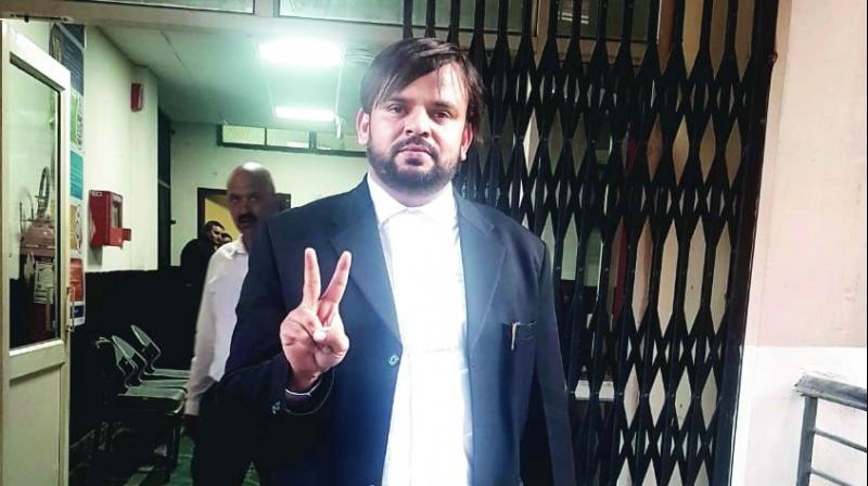 Mubeen Farooqi making a ‘victory’ sign outside the Court in Pathankot. Mubeen Farooqi making a ‘victory’ sign outside the Court in Pathankot.
