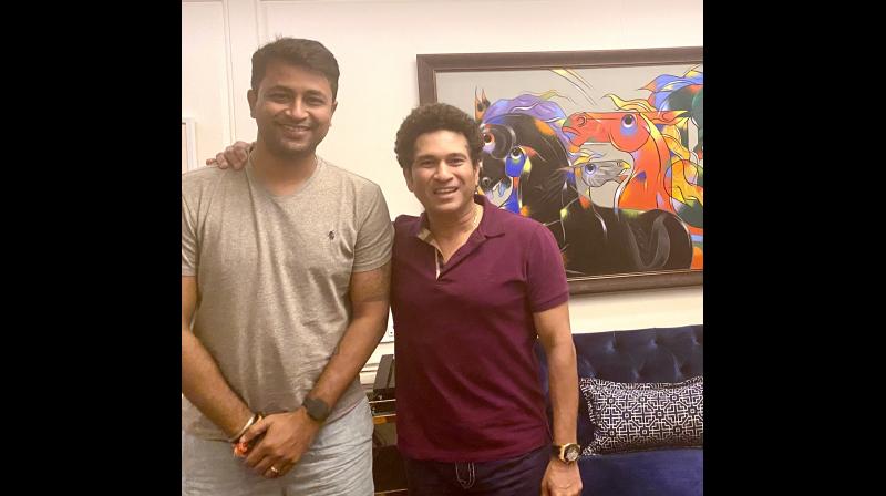Pragyan Ojha and Sachin Tendulkar Pragyan Ojha and Sachin Tendulkar