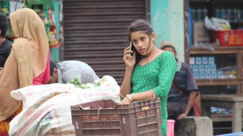 18-year-old Kusum Shrestha, of Gorkha district, was photographed carrying vegetables at a local market during her vacation. (Photo: Facebook/ Indian Citizen) 18-year-old Kusum Shrestha, of Gorkha district, was photographed carrying vegetables at a local market during her vacation. (Photo: Facebook/ Indian Citizen)