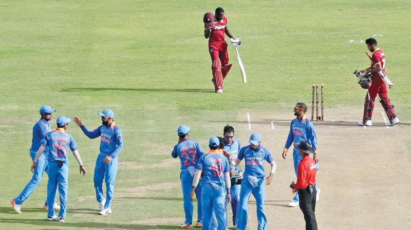 India celebrate their third ODI win against West Indies. India celebrate their third ODI win against West Indies.