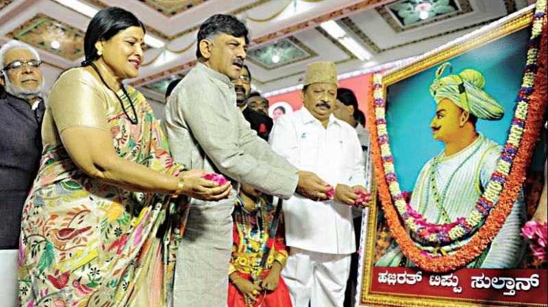 Ministers D.K. Shivakumar and Jayamala offer floral tributes to Tipu Sultan at a function in Vidhana Soudha on Saturday (Photo: DC ) Ministers D.K. Shivakumar and Jayamala offer floral tributes to Tipu Sultan at a function in Vidhana Soudha on Saturday (Photo: DC )