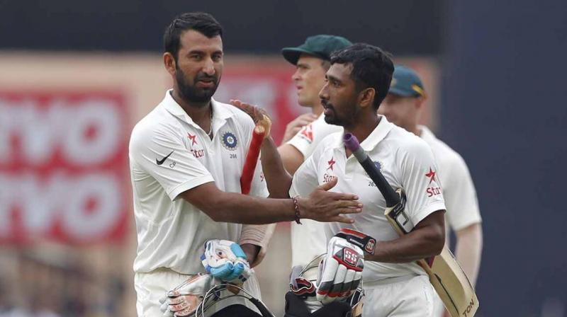 Cheteshwar Pujara (202) and Wriddhiman Saha (117) steered India to 603 for nine against Australia and gave the team a substantial 152-run lead. (Photo: BCCI) Cheteshwar Pujara (202) and Wriddhiman Saha (117) steered India to 603 for nine against Australia and gave the team a substantial 152-run lead. (Photo: BCCI)