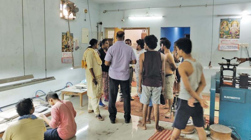 Bonded labourers being rescued from a jewellery making unit on Walltax road in Chennai. (Photo: DC) Bonded labourers being rescued from a jewellery making unit on Walltax road in Chennai. (Photo: DC)