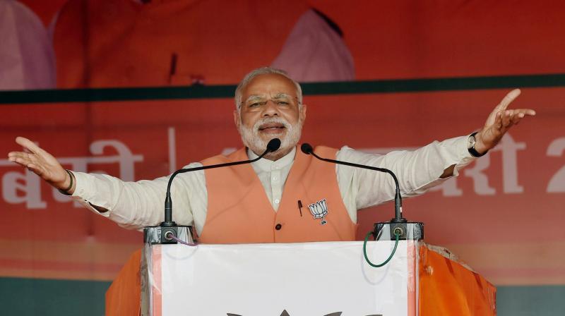 Prime Minister Narendra Modi at an election campaign rally. (Photp: PTI) Prime Minister Narendra Modi at an election campaign rally. (Photp: PTI)