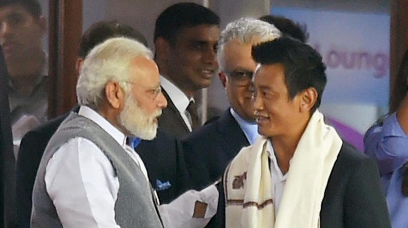 Prime minister Modi felicitated the captains of Indian football teams that played in the Asian Games, including Baichung Bhutia. (Photo: PTI) Prime minister Modi felicitated the captains of Indian football teams that played in the Asian Games, including Baichung Bhutia. (Photo: PTI)