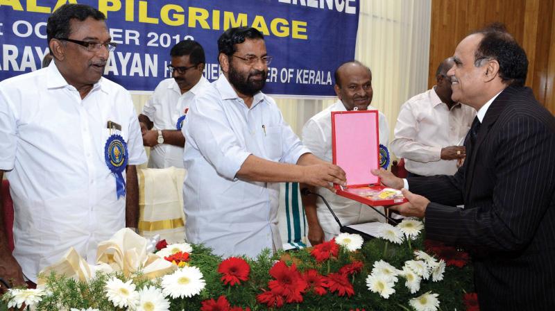 Devaswom minister Kadakampalli Surendran presents memento to Karnataka Chief secretary Gangaram Baderia during the south Indian minister's meet , in Thiruvananthapuram on Wednesday. TDB president A. Padmakumar and TDB member K.P. Sankaradas look on (Photo: Peethambaran Payyeri) Devaswom minister Kadakampalli Surendran presents memento to Karnataka Chief secretary Gangaram Baderia during the south Indian minister's meet , in Thiruvananthapuram on Wednesday. TDB president A. Padmakumar and TDB member K.P. Sankaradas look on (Photo: Peethambaran Payyeri)