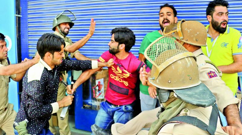 Police arrested dozens of youths during clashes at Lal Chowk triggered by the killing of a top LeT militant and a civilian in Pulwama encounter. (Photo: H.U. Naqash) Police arrested dozens of youths during clashes at Lal Chowk triggered by the killing of a top LeT militant and a civilian in Pulwama encounter. (Photo: H.U. Naqash)