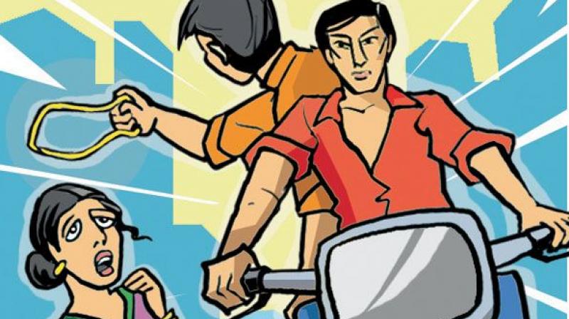 "The other man came towards me and touched my feet. He then got up and pushed me, following which he snatched my chain and fled on their motorcycles," the complaint said. (Representational Image) "The other man came towards me and touched my feet. He then got up and pushed me, following which he snatched my chain and fled on their motorcycles," the complaint said. (Representational Image)