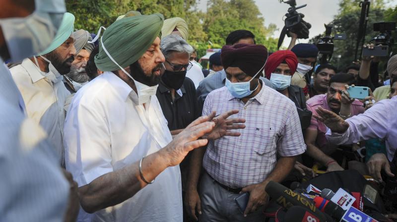 Captain Amarinder Singh speaks to media after submitting his resignation to Governor Purohit Banwarilal at Raj Bhavan in Chandigarh, Saturday, Sept. 18, 2021. (PTI)