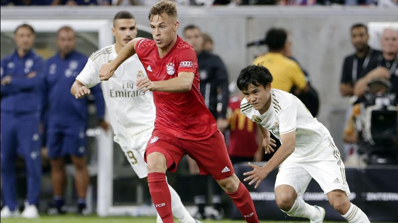 Real, who started with a full-strength side that included a debut for former Chelsea attacking midfielder Eden Hazard went 1-0 down after just a quarter of an hour. Real, though, had the better of the first half with only Manuel Neuer’s presence and Karim Benzema’s profligacy preventing them from drawing equal in a relaxed but end-to-end match. (Photo:AFP) Real, who started with a full-strength side that included a debut for former Chelsea attacking midfielder Eden Hazard went 1-0 down after just a quarter of an hour. Real, though, had the better of the first half with only Manuel Neuer’s presence and Karim Benzema’s profligacy preventing them from drawing equal in a relaxed but end-to-end match. (Photo:AFP)