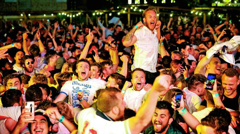 England fans in Russia celebrate after beating Colombia to enter the World Cup quarterfinals. (Photo:AP) England fans in Russia celebrate after beating Colombia to enter the World Cup quarterfinals. (Photo:AP)