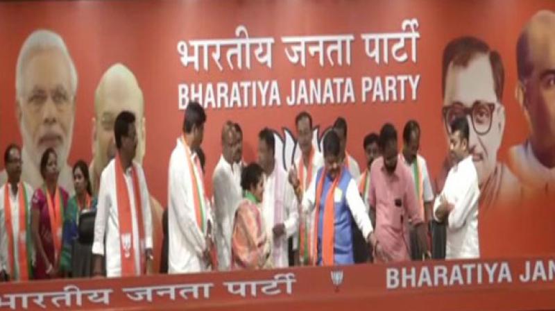 Trinamool Congress MLA Sunil Singh along with 12 TMC councillors on Monday joined BJP in presence of Kailash Vijayvargiya and Mukul Roy on Monday. (Photo: ANI) Trinamool Congress MLA Sunil Singh along with 12 TMC councillors on Monday joined BJP in presence of Kailash Vijayvargiya and Mukul Roy on Monday. (Photo: ANI)