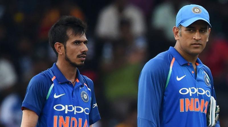 Just like any other youngster, Chahal couldnât control himself when he was about to meet the veteran wicket-keeper batsman. (Photo: AFP)