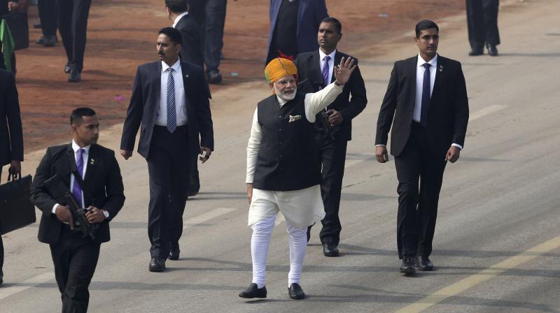 Prime Minister Narendra Modi waves to the crowd during Republic Day parade in New Delhi. (Photo: AP) Prime Minister Narendra Modi waves to the crowd during Republic Day parade in New Delhi. (Photo: AP)