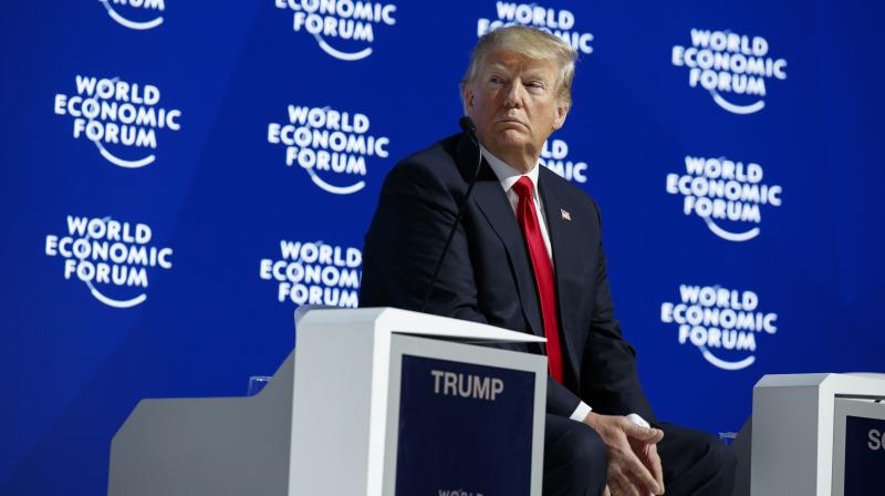 US President Donald Trump listens as he is introduced to deliver a speech to the World Economic Forum. (Photo: AP) US President Donald Trump listens as he is introduced to deliver a speech to the World Economic Forum. (Photo: AP)