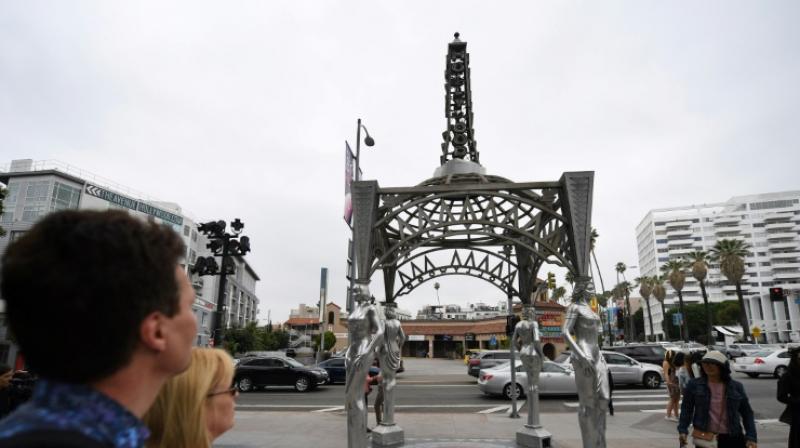 Authorities said a witness saw a man climb the Eiffel Tower-shaped structure late Sunday and use a saw to remove the statue. (Photo: AFP) Authorities said a witness saw a man climb the Eiffel Tower-shaped structure late Sunday and use a saw to remove the statue. (Photo: AFP)