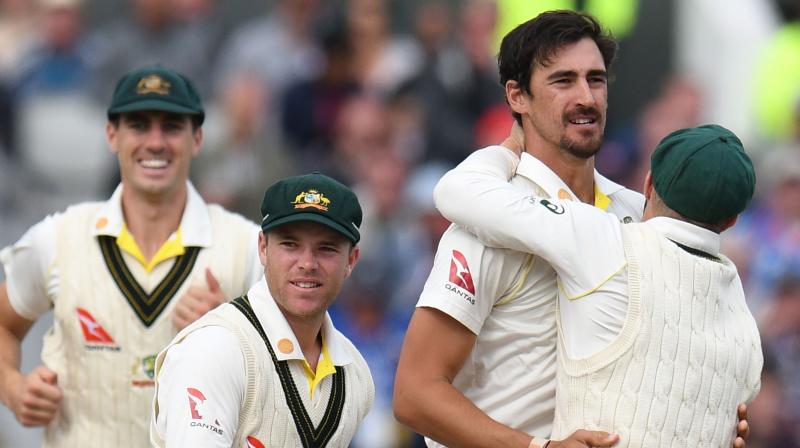 Mitchell Starc celebrates the fall of wickets with his teammates. (Photo:AFP) Mitchell Starc celebrates the fall of wickets with his teammates. (Photo:AFP)