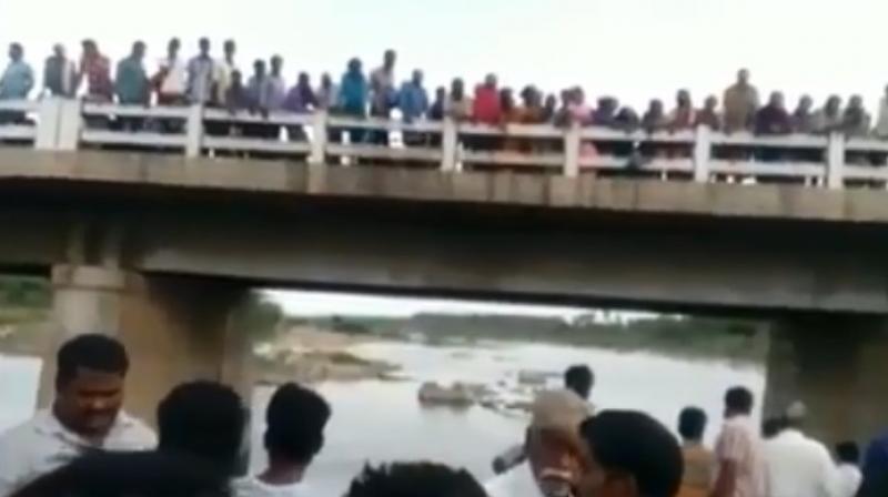 The police was called in by local people who were shaken by the tragic sight and took the bodies out of the river. (Photo: YouTube | Screengrab) The police was called in by local people who were shaken by the tragic sight and took the bodies out of the river. (Photo: YouTube | Screengrab)