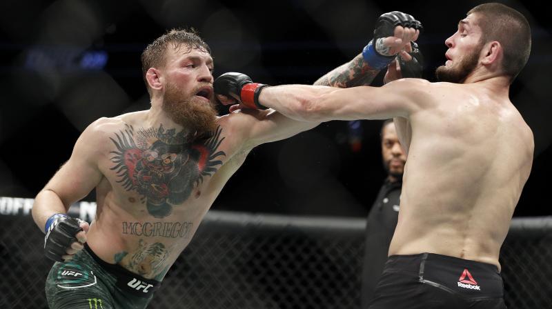 McGregor managed to roll away briefly before Nurmagomedov ended up in a full mount, getting him in a brutal rear-naked chokehold that had McGregor tapping out at 3min 3sec of the round. (Photo: AP) McGregor managed to roll away briefly before Nurmagomedov ended up in a full mount, getting him in a brutal rear-naked chokehold that had McGregor tapping out at 3min 3sec of the round. (Photo: AP)