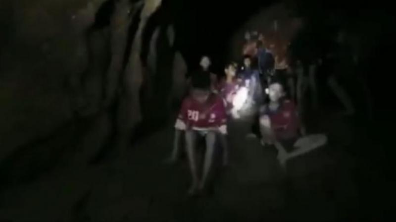 They appeared exhausted, rake thin, sensitive to the light but lucid, with some speaking faltering English to try to communicate with the unidentified diver. (Photo: Screengrab/AFP) They appeared exhausted, rake thin, sensitive to the light but lucid, with some speaking faltering English to try to communicate with the unidentified diver. (Photo: Screengrab/AFP)