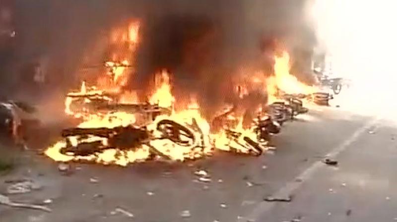 Vehicle burn outside the Ice House Police Station near Marina Beach. (Photo: ANI/Twitter) Vehicle burn outside the Ice House Police Station near Marina Beach. (Photo: ANI/Twitter)