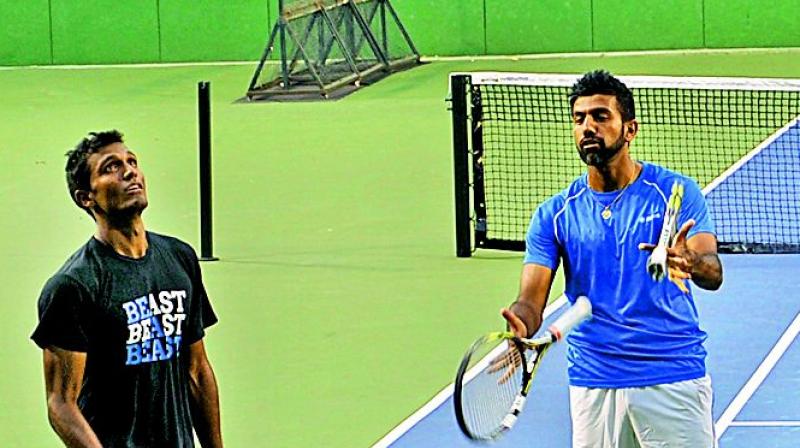 Sriram Balaji (left) and Rohan Bopanna (right) at a training session in Bengaluru on Tuesday, ahead of their Davis Cup Group I tie against Uzbekistan. (Photo: Shashidhar B) Sriram Balaji (left) and Rohan Bopanna (right) at a training session in Bengaluru on Tuesday, ahead of their Davis Cup Group I tie against Uzbekistan. (Photo: Shashidhar B)